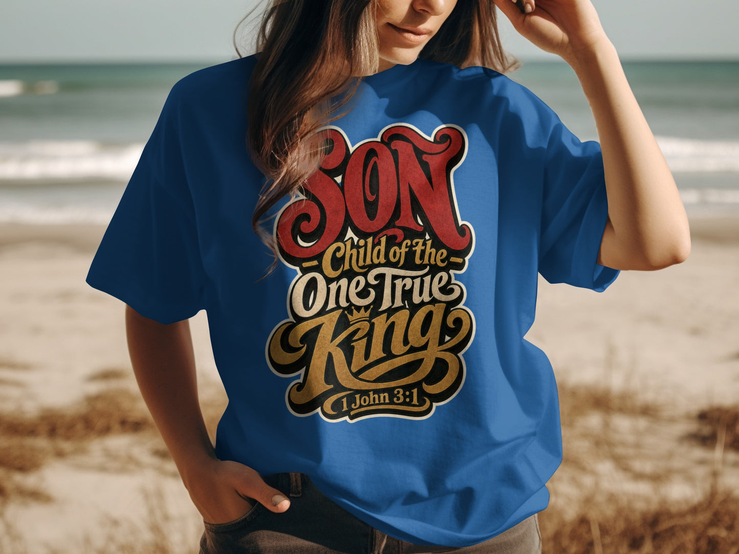 Blue t-shirt with text "SON Child of the One True King 1 John 3:1".