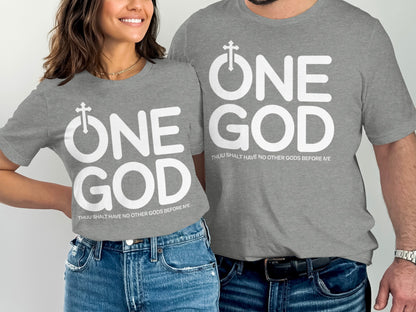 Two people wearing grey t-shirts with white "ONE GOD" text and a cross symbol.