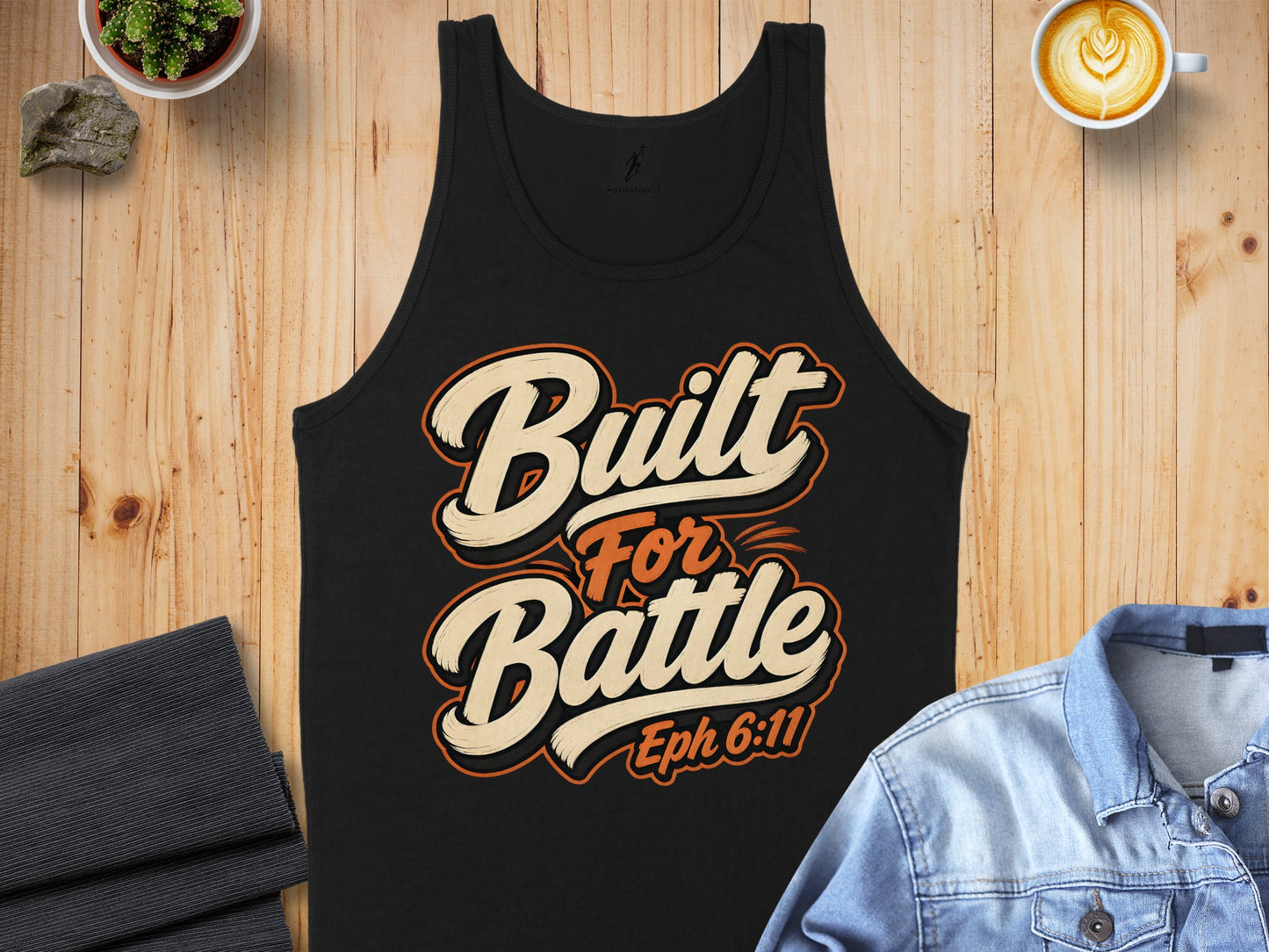 Black tank top with "Built For Battle Eph 6:11" text and graphic design.