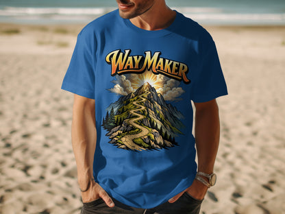 Blue t-shirt with "Way Maker" text above a winding mountain path and sunburst graphic.