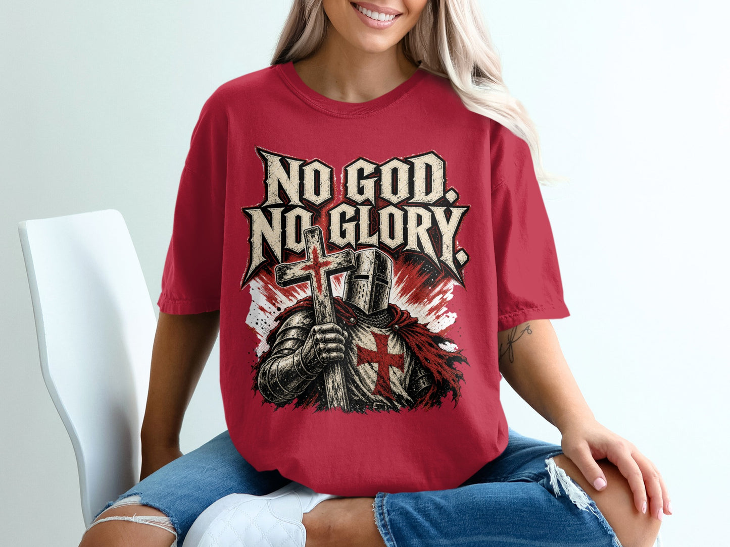 Red t-shirt featuring knight in armor holding cross and text "NO GOD. NO GLORY."