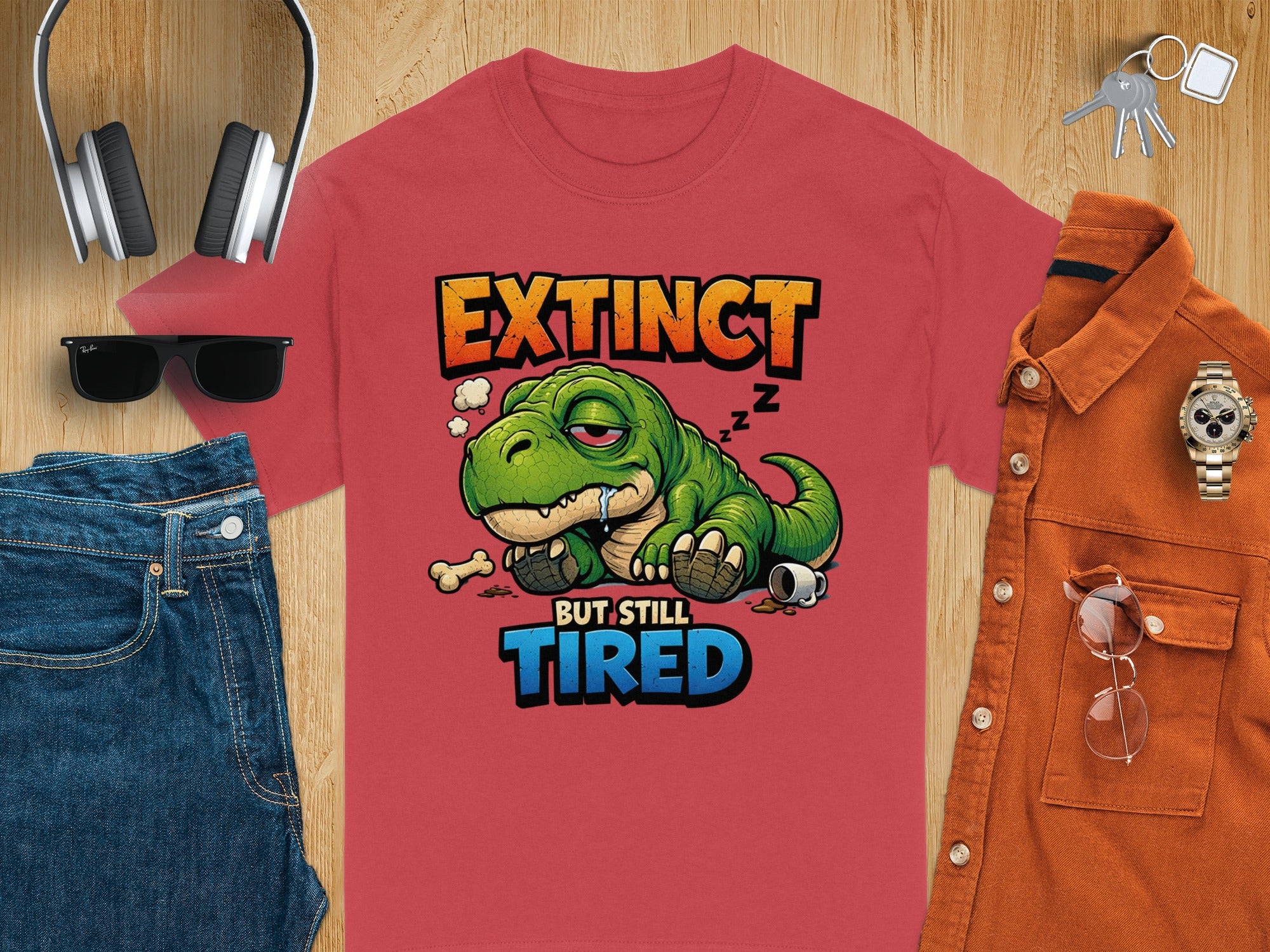 Red t-shirt with a T-Rex saying "Extinct but still tired".