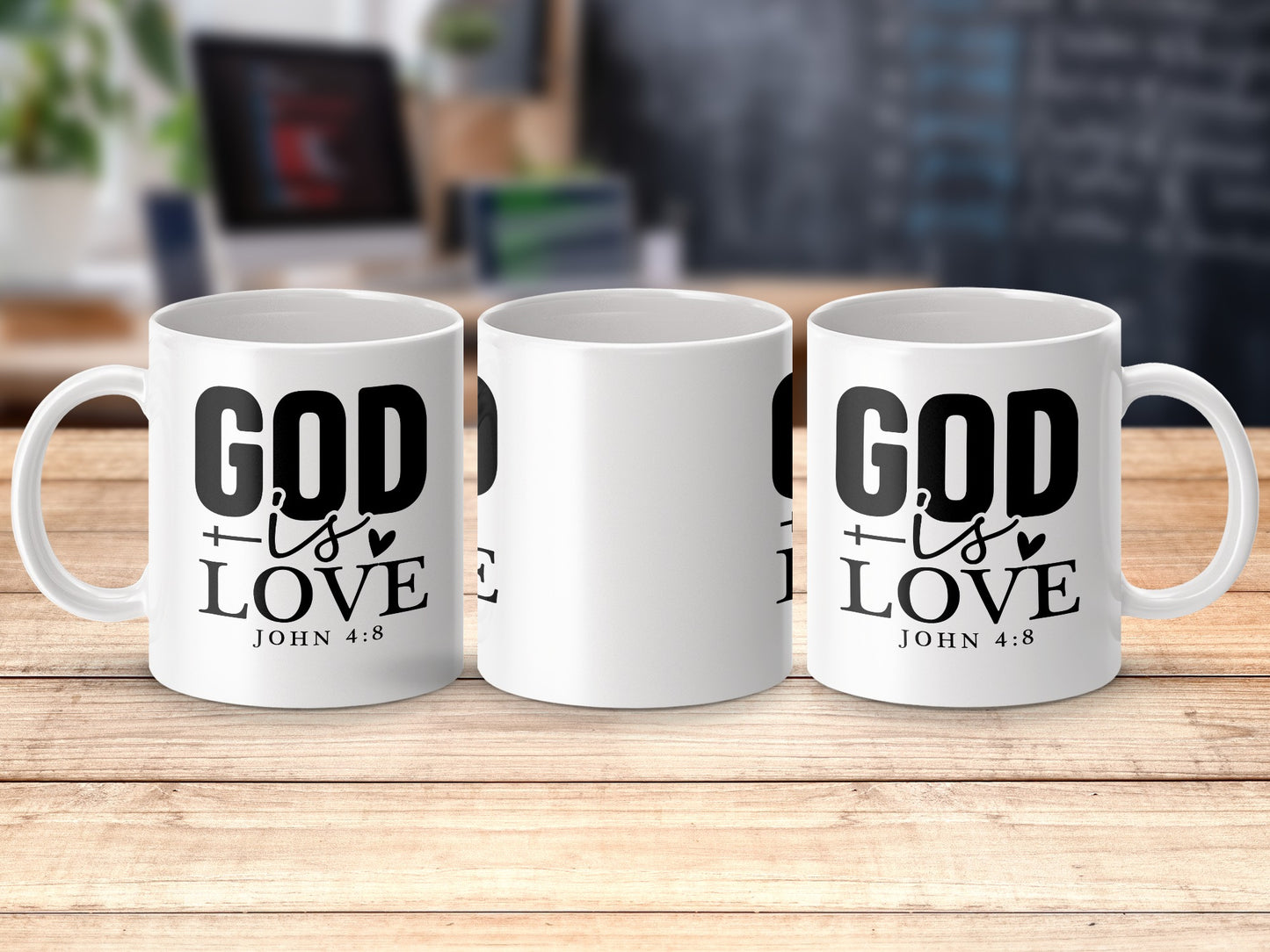 White mugs with "God is Love, John 4:8" text on a wooden surface.