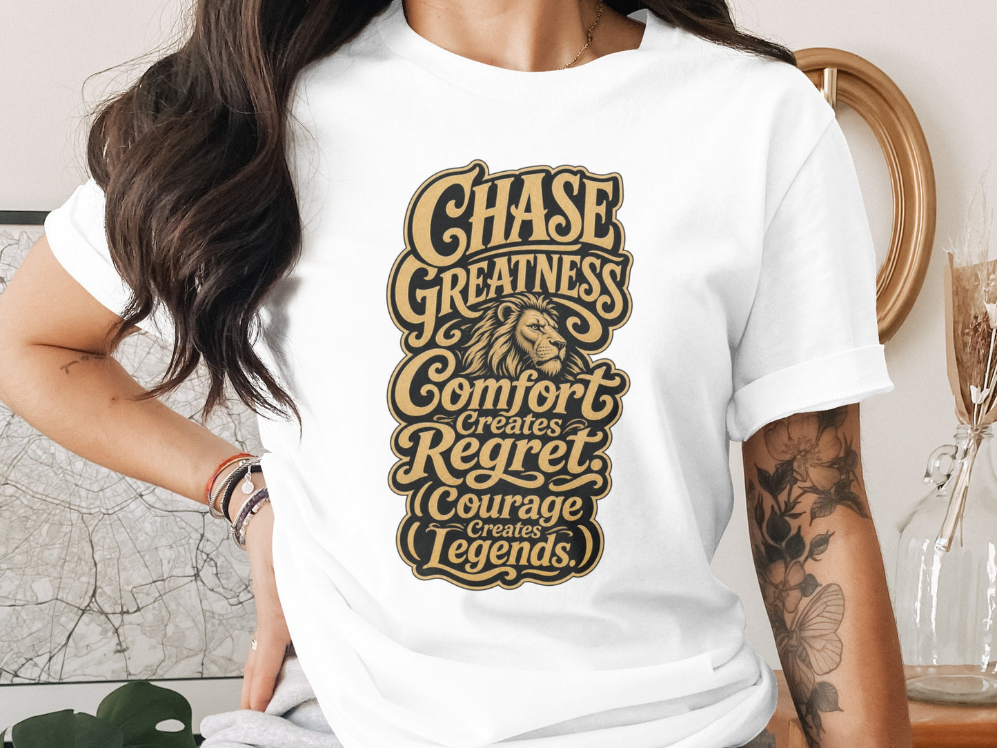 White t-shirt with "Chase Greatness Comfort Creates Regret Courage Creates Legends" text.
