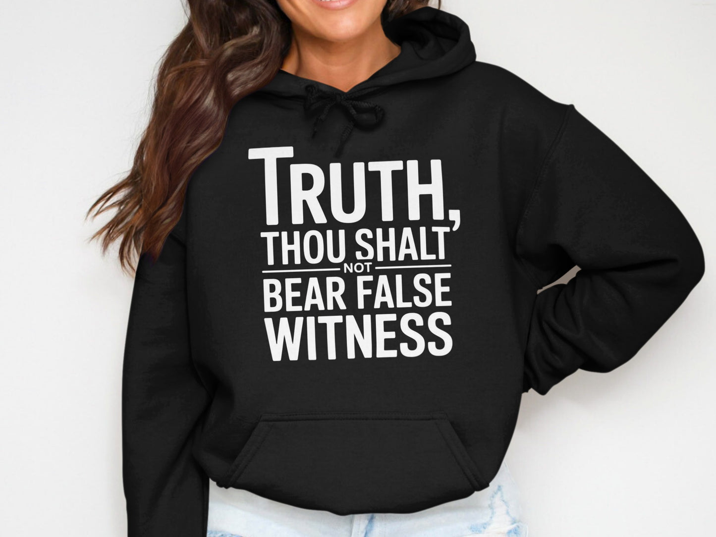 Black hoodie with white text reading "Truth, Thou Shalt Not Bear False Witness."