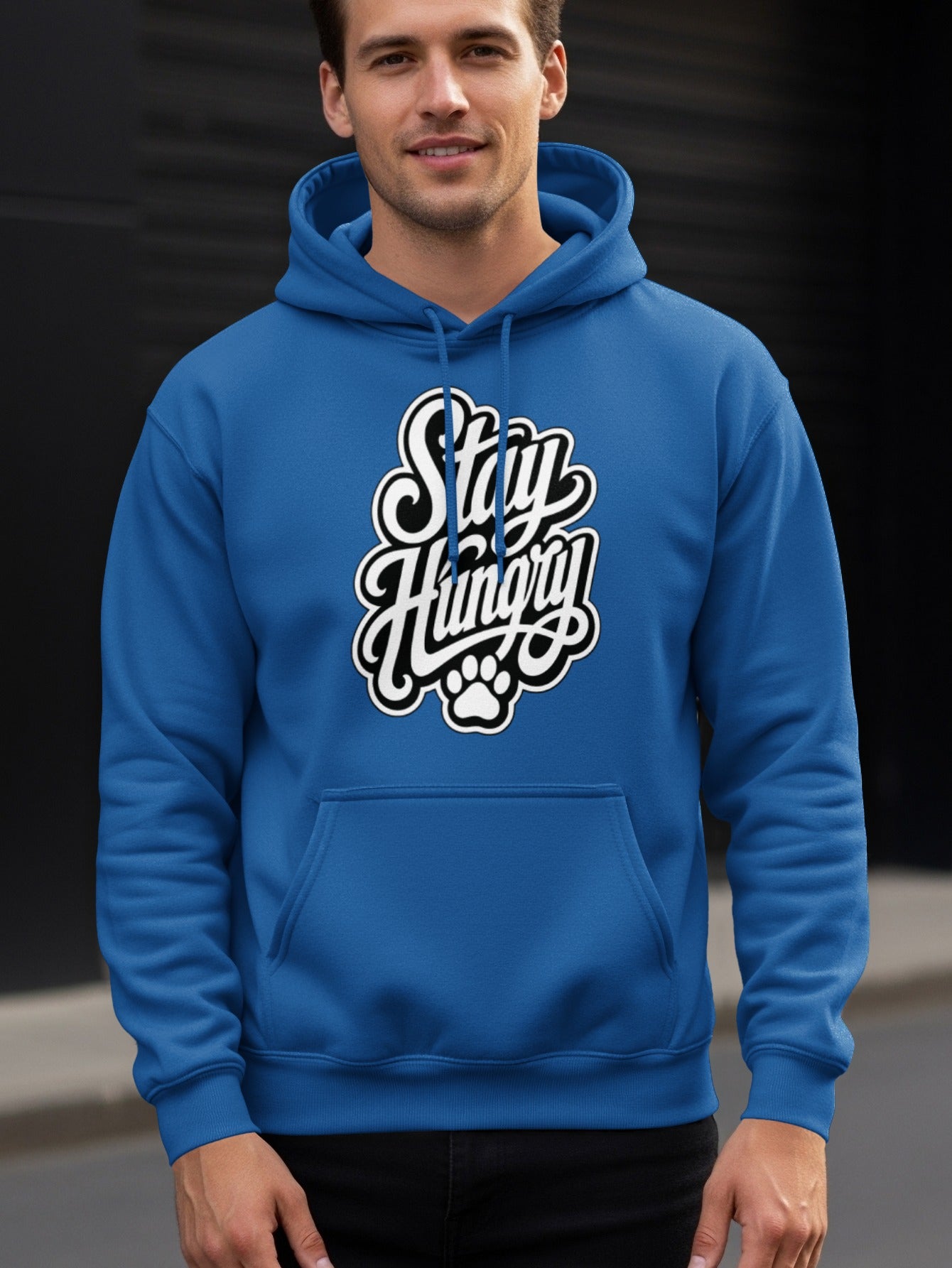 Blue hoodie with white script text "Stay Hungry" and paw print.