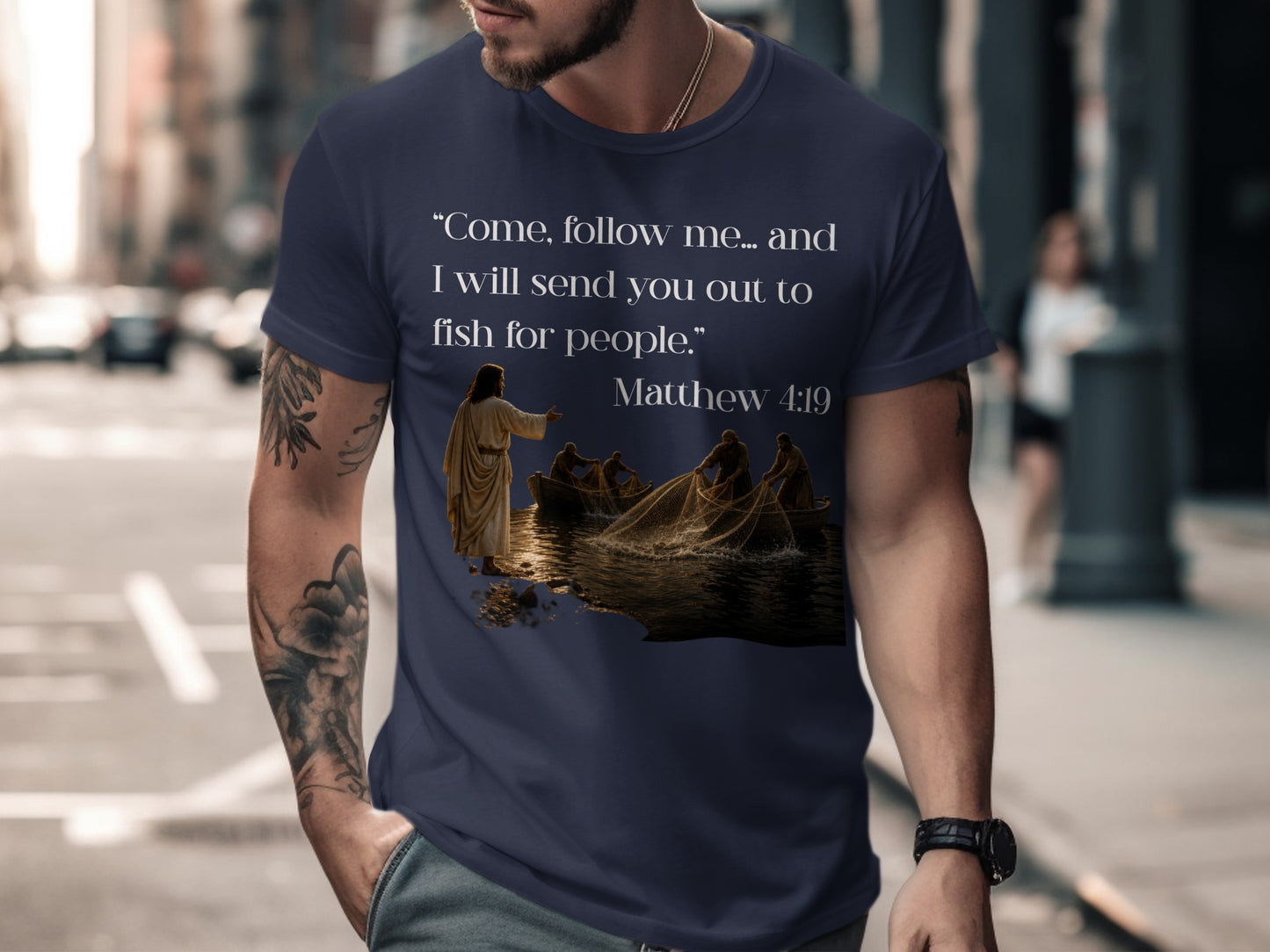 Dark blue t-shirt with Matthew 4:19 quote and Jesus calling disciples.