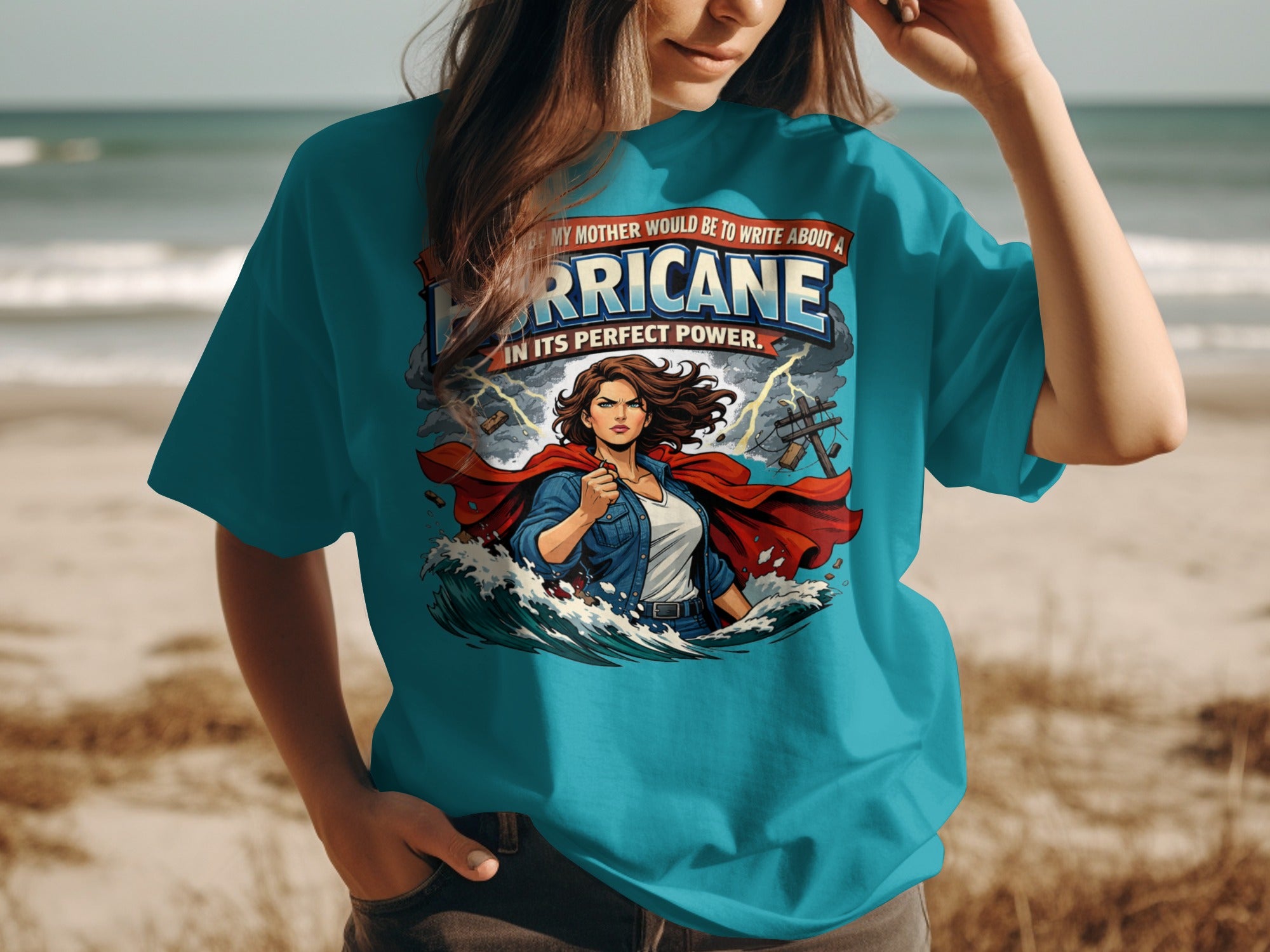 T-shirt with text "Hurricane In Its Perfect Power" and a female superhero graphic.