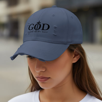 Distressed grey baseball cap with "GOD is good all the time" text.