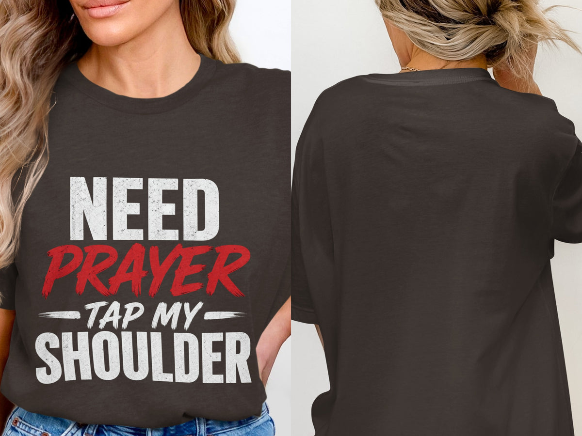Dark gray t-shirt with white and red text: "NEED PRAYER - TAP MY SHOULDER"