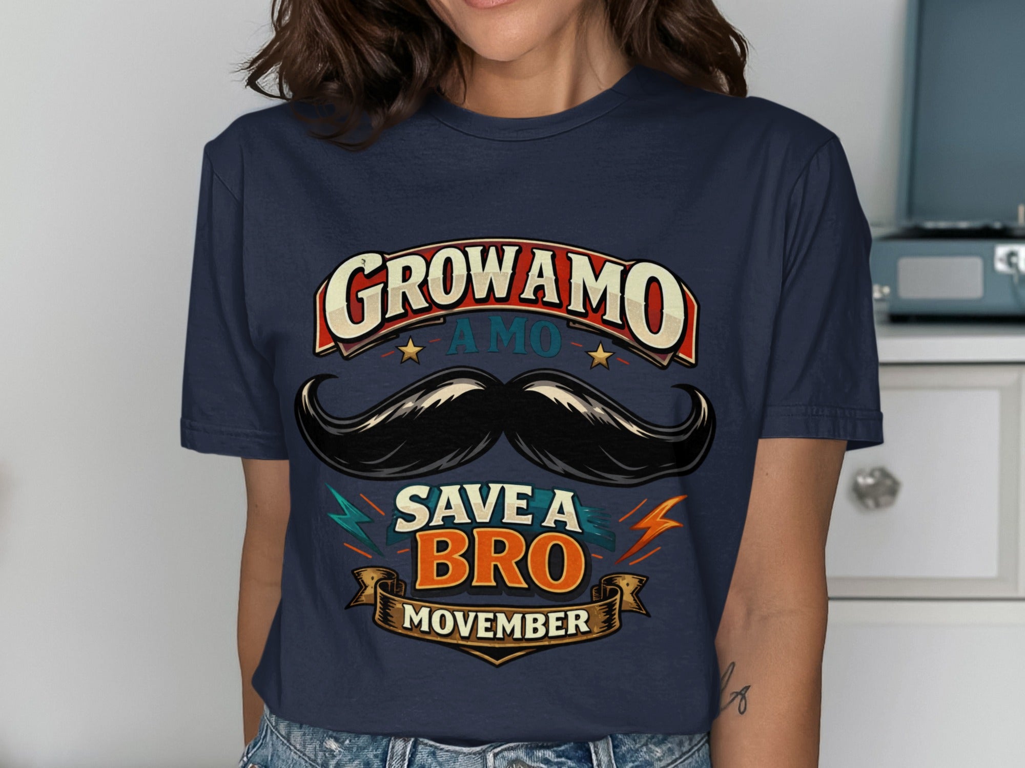 Navy t-shirt with GROW AMO SAVE A BRO MOVEMBER text and mustache graphic.