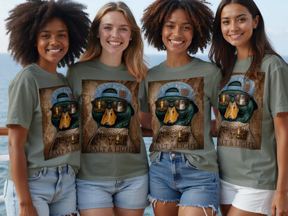 Green t-shirt with duck graphic wearing sunglasses, hat, and necklace, reading "SALT & LIGHT".