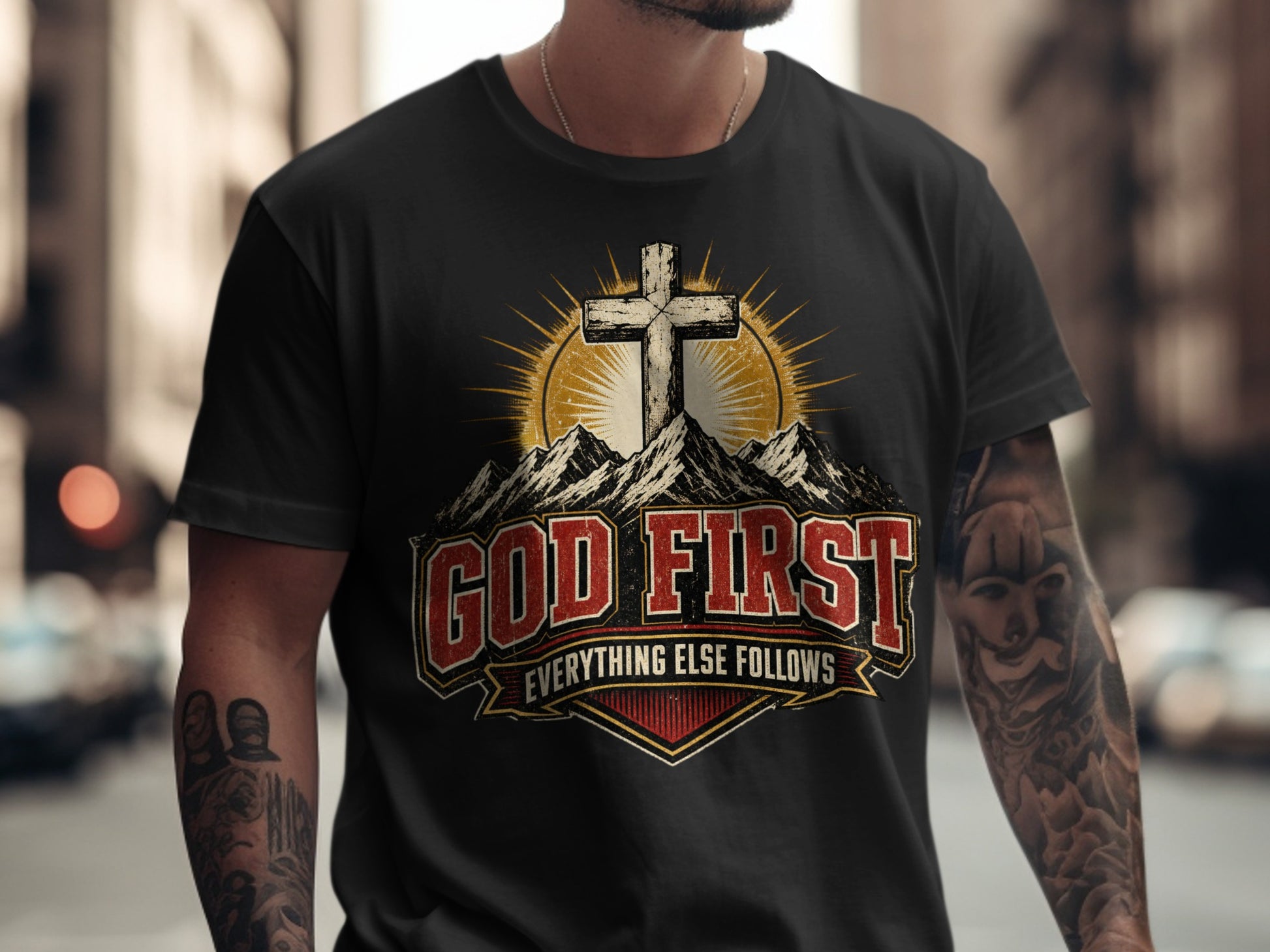 Black t-shirt with "God First, Everything Else Follows" text and a cross.