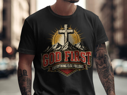 Black t-shirt with "God First, Everything Else Follows" text and a cross.