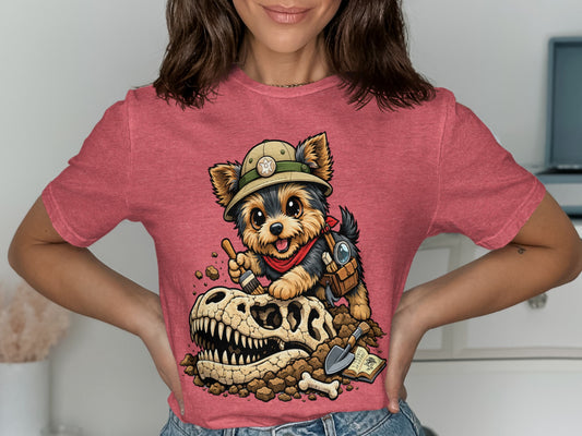 Yorkshire terrier in safari hat digs up dinosaur skull with brush and shovel.