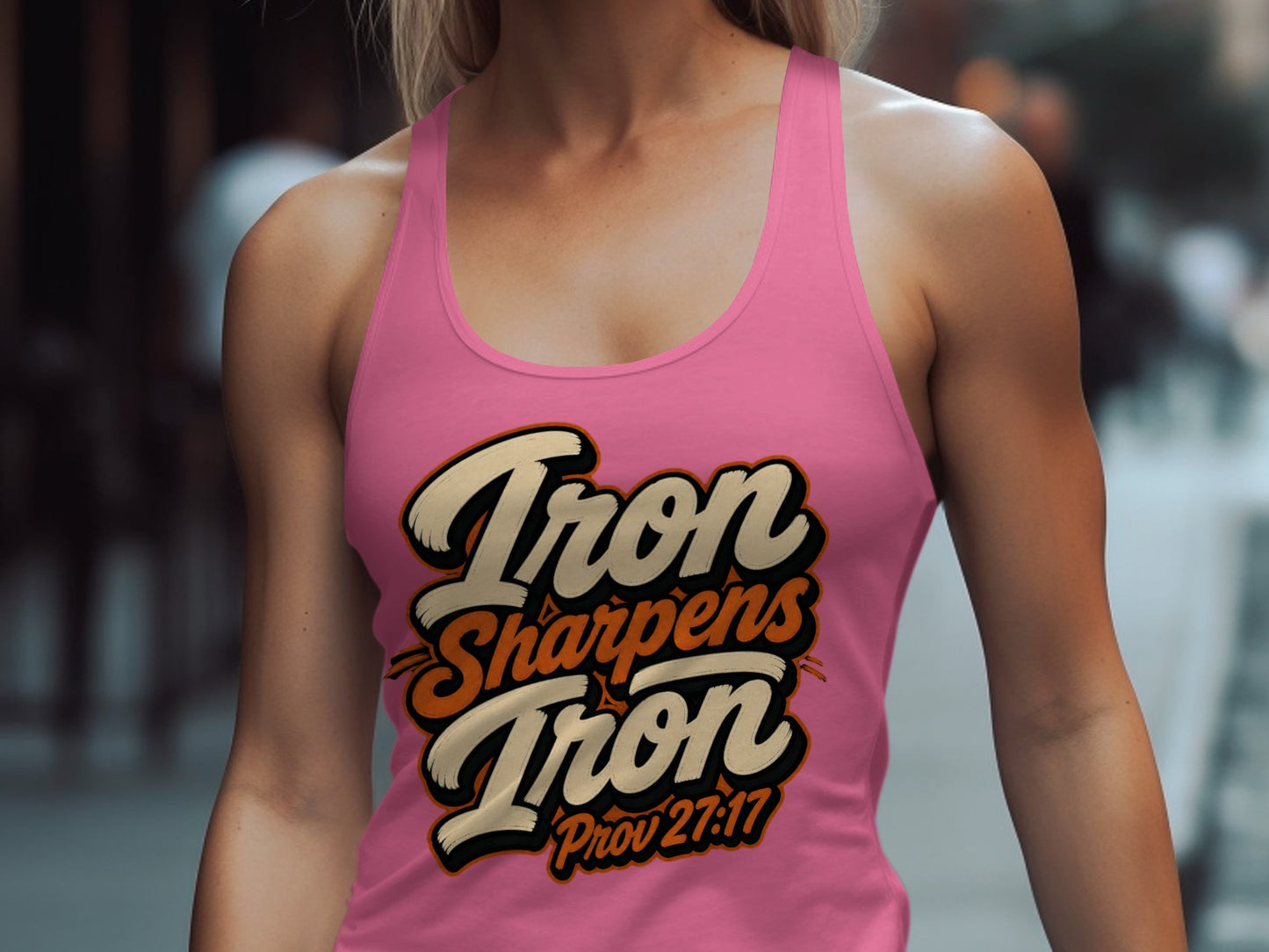 Pink tank top with "Iron Sharpens Iron Prov 27:17" graphic design.