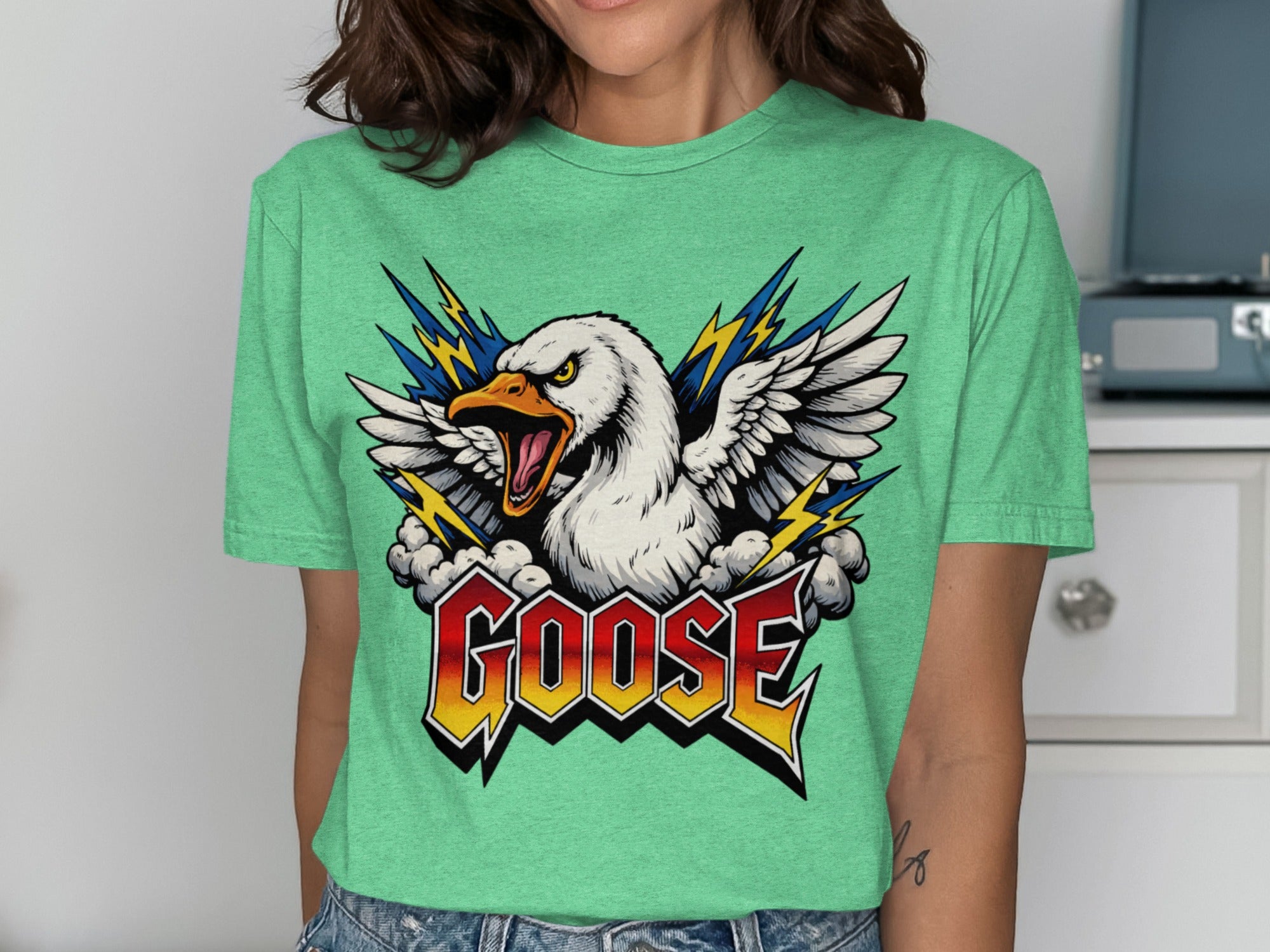 Green t-shirt with graphic of a screaming goose, lightning, and the word GOOSE.