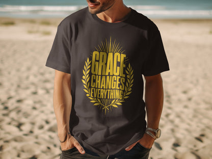 Dark t-shirt with gold text "GRACE CHANGES EVERYTHING" in laurel wreath design