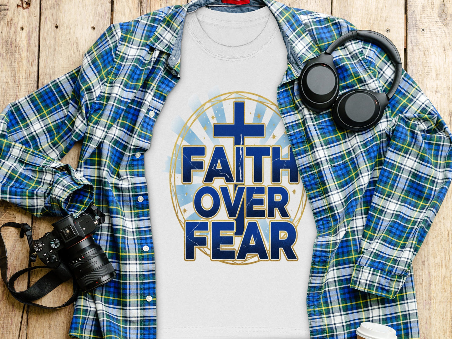 White t-shirt with blue text "FAITH OVER FEAR" and a cross graphic.