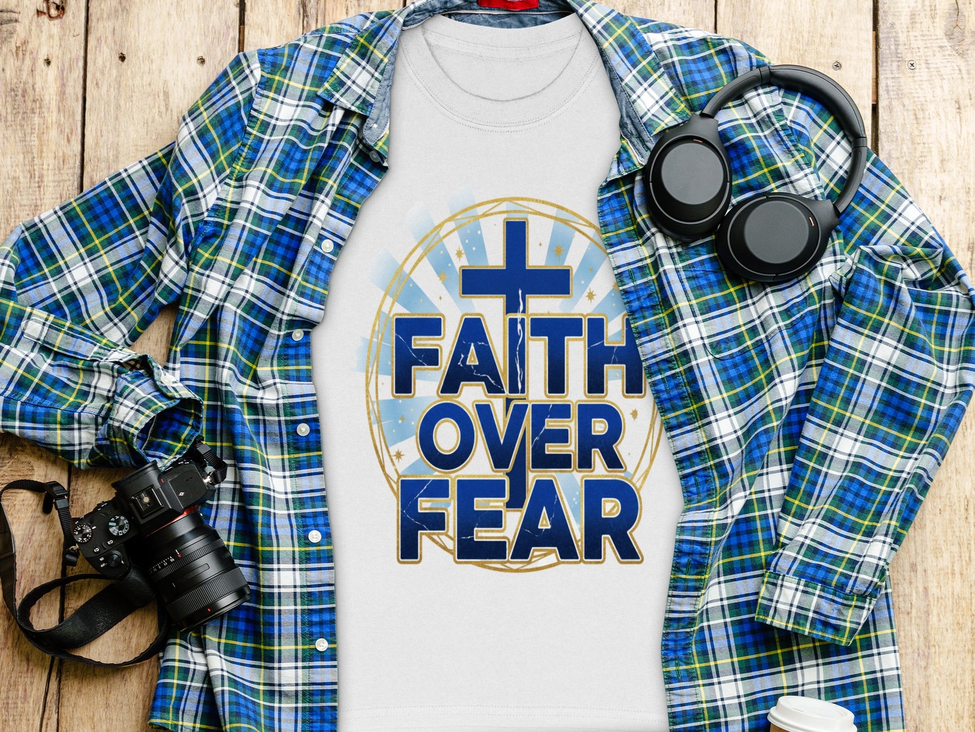 White t-shirt with blue text "FAITH OVER FEAR" and a cross graphic.