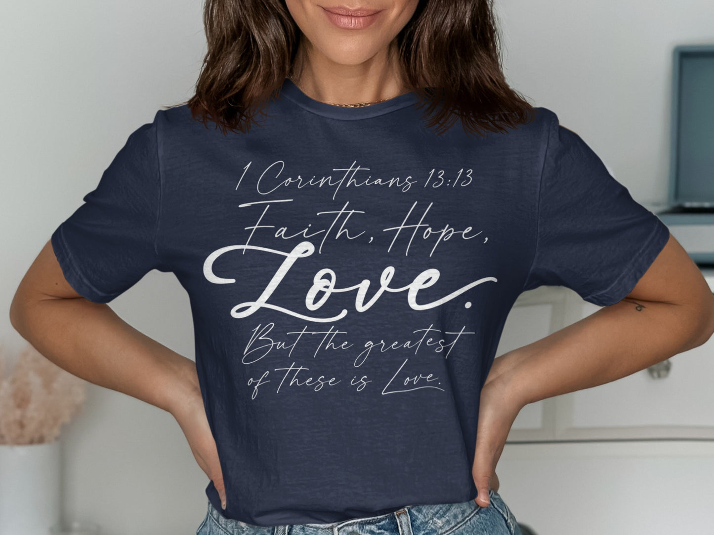 Navy t-shirt with white text: 1 Corinthians 13:13, Faith, Hope, Love, But the greatest of these is Love.