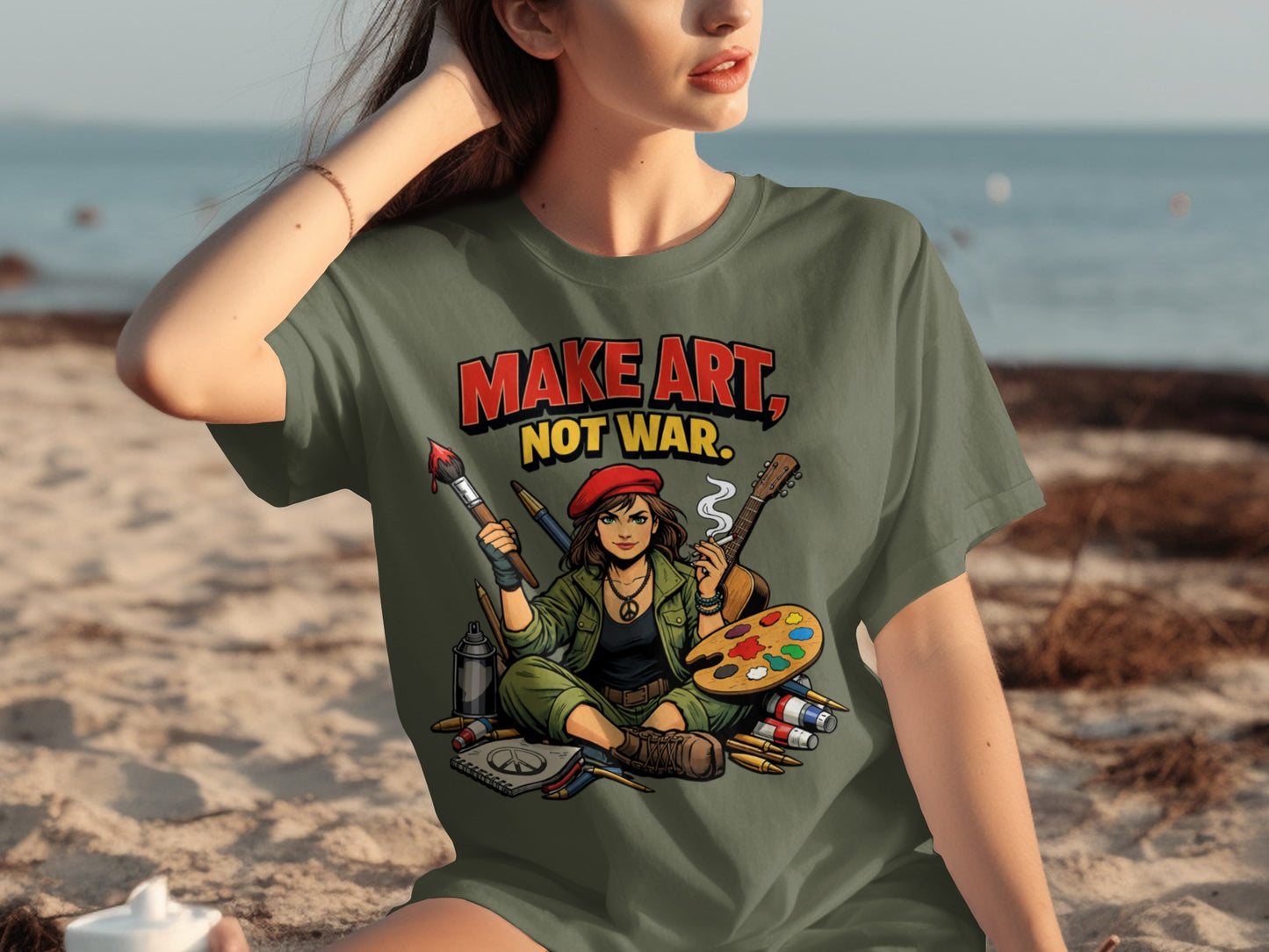 Olive green t-shirt with "MAKE ART, NOT WAR" graphic featuring an artist with art supplies.