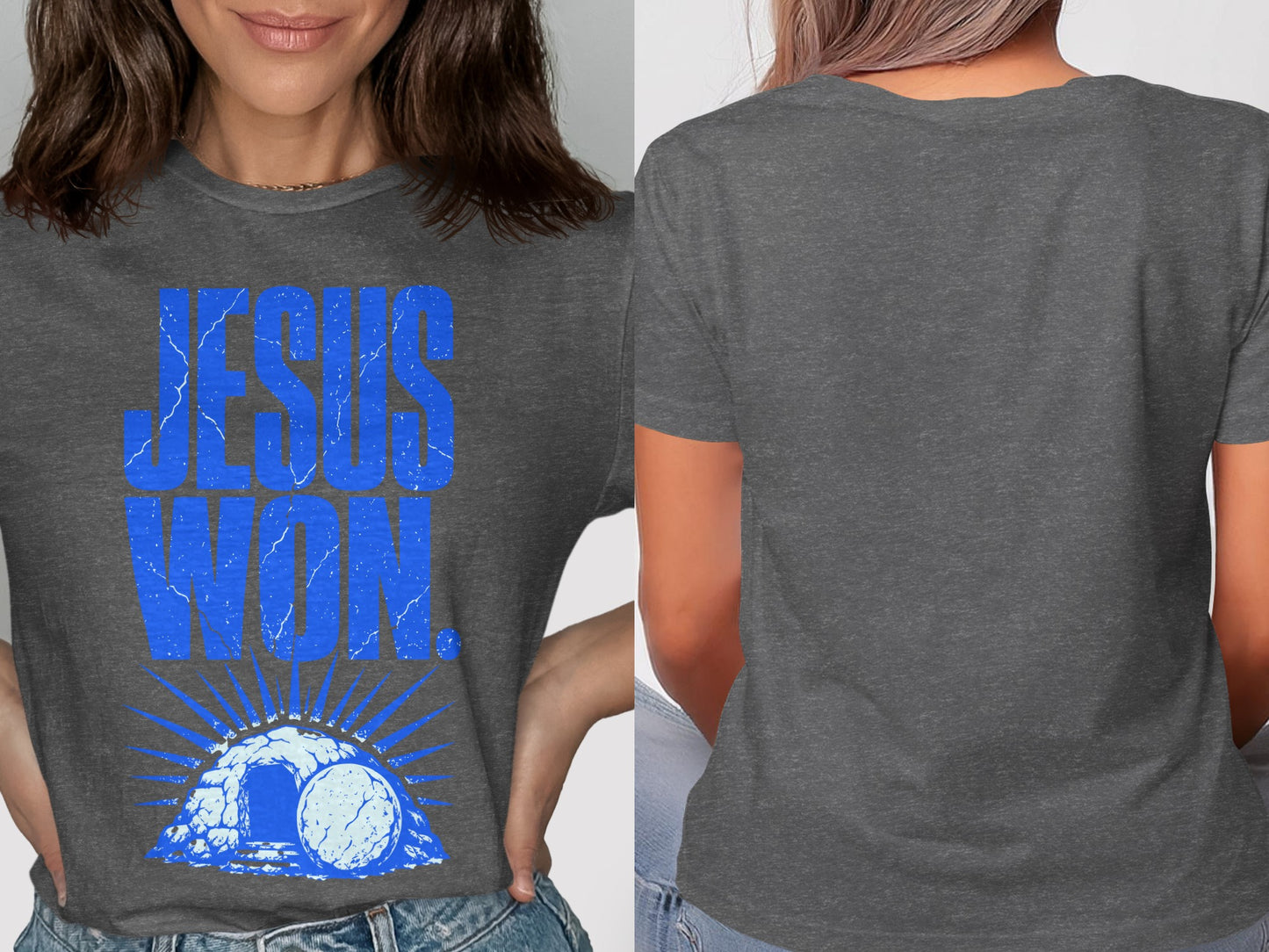 Dark gray t-shirt with blue "JESUS WON" text over an open tomb graphic.