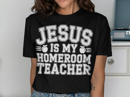 Black t-shirt with white text "JESUS IS MY HOMEROOM TEACHER" and apple graphics.