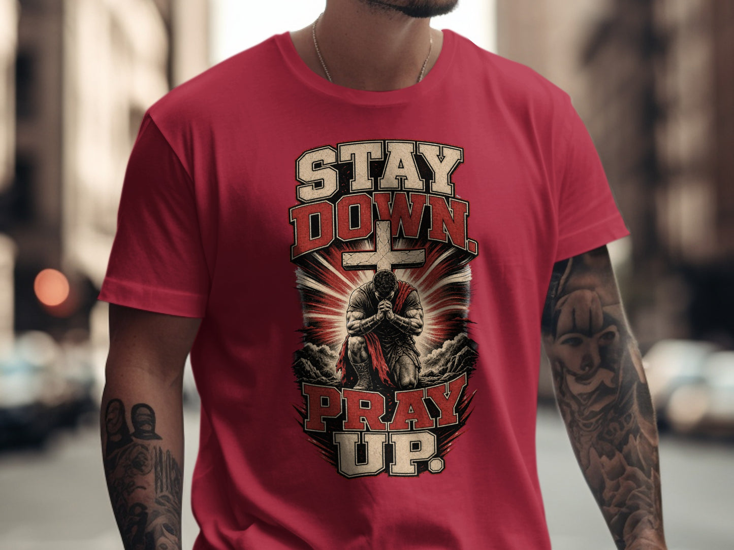 Red t-shirt with "STAY DOWN PRAY UP" text and a praying warrior graphic.