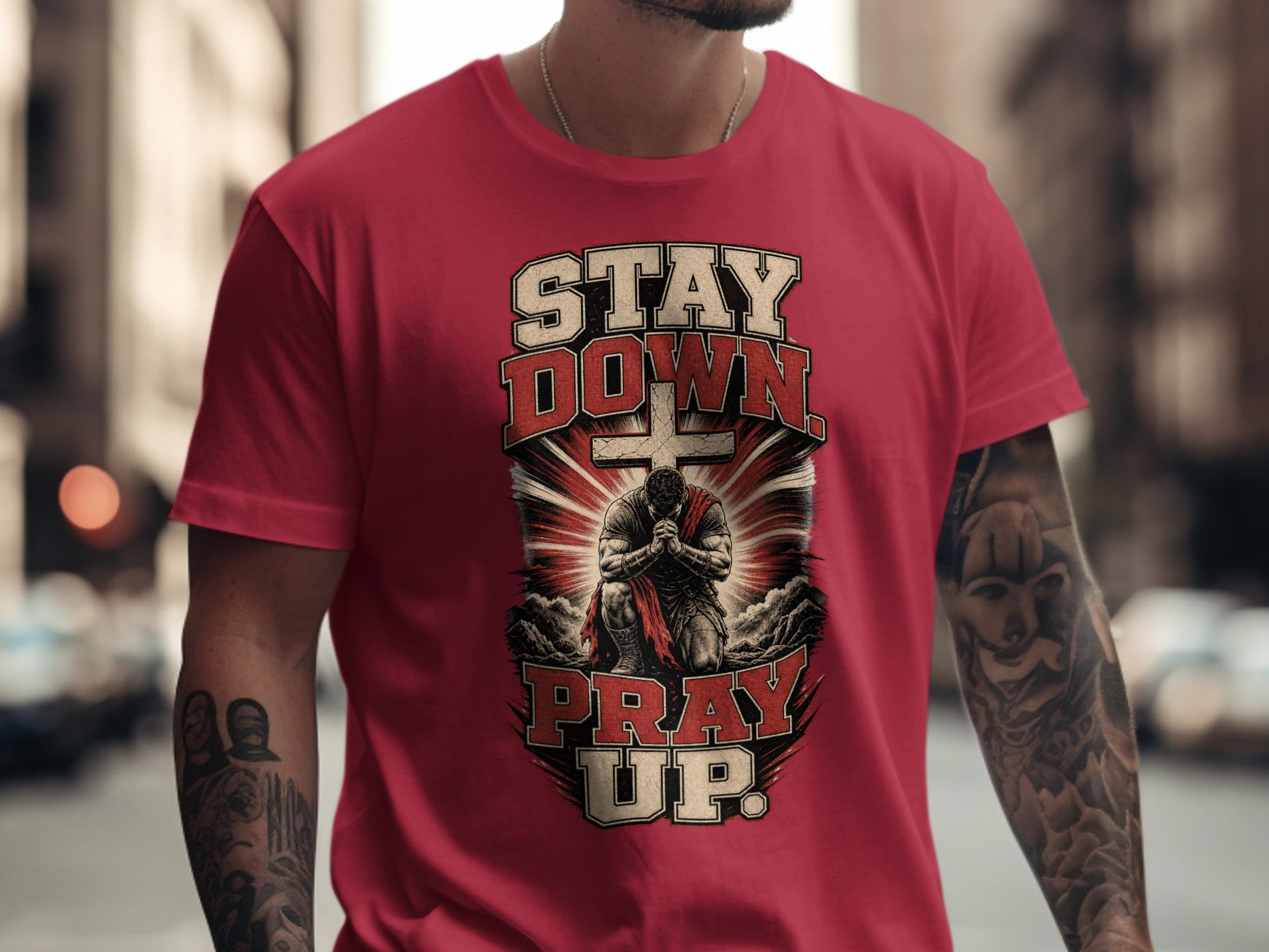 Red t-shirt with "STAY DOWN PRAY UP" text and a praying warrior graphic.