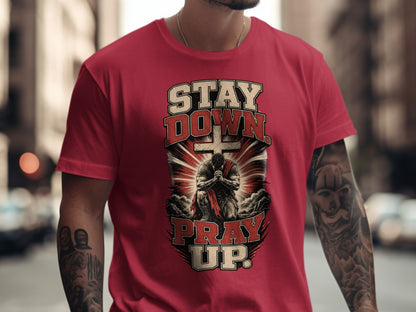 Red t-shirt with "STAY DOWN PRAY UP" text and a praying warrior graphic.