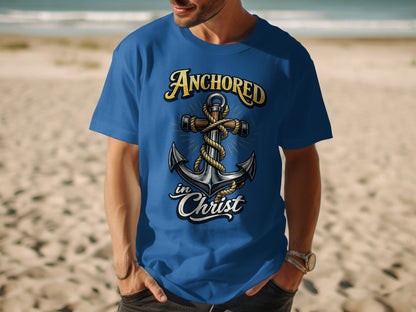 Blue t-shirt with a graphic of an anchor and the text "Anchored in Christ."