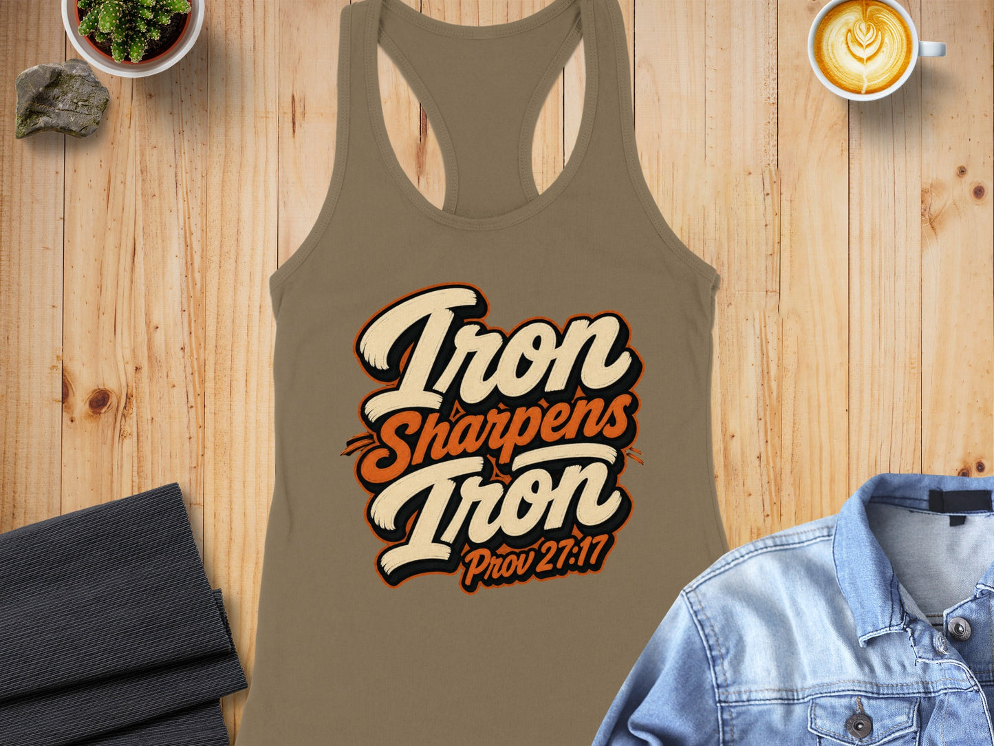 Tan racerback tank top with "Iron Sharpens Iron Prov 27:17" graphic.