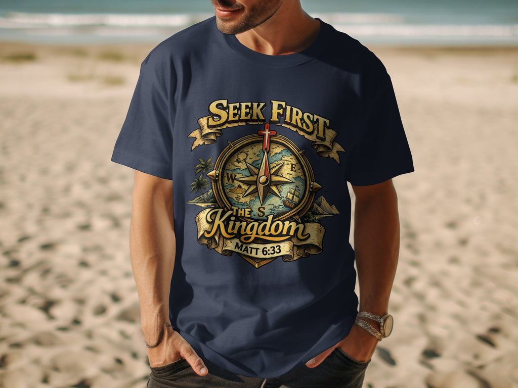 Navy t-shirt with graphic of compass, cross, and text "Seek First The Kingdom".