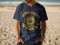 Navy t-shirt with graphic of compass, cross, and text "Seek First The Kingdom".