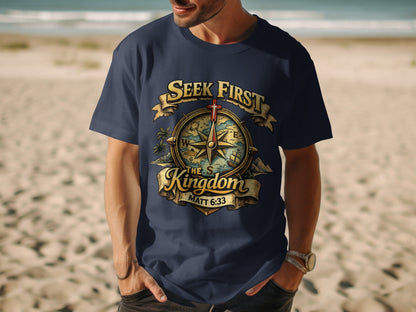 Navy t-shirt with graphic of compass, cross, and text "Seek First The Kingdom".
