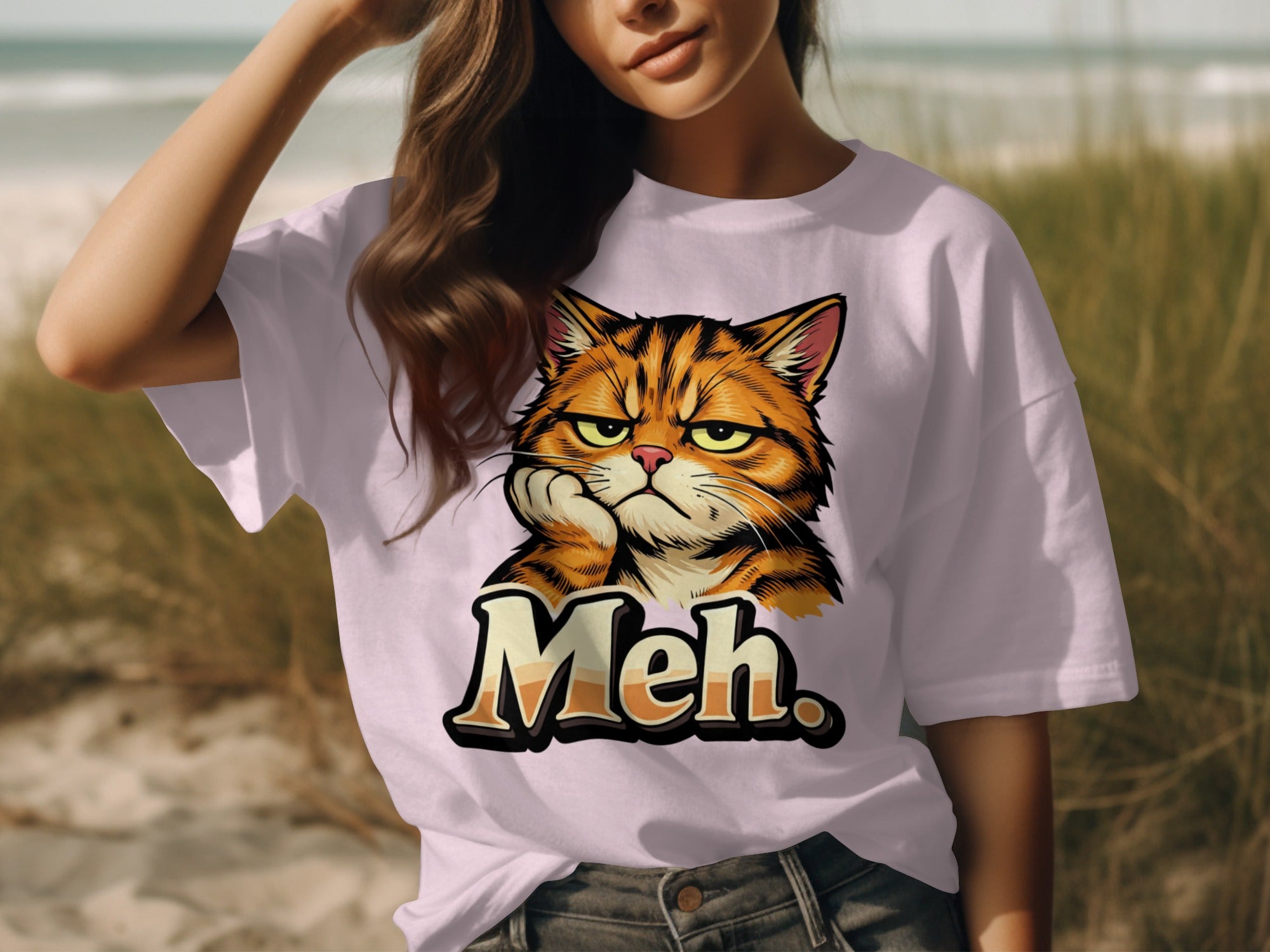 T-shirt with print of an orange tabby cat looking bored with paw on cheek and the word "Meh."