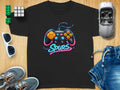 Black t-shirt with neon video game controller and "Spurs" text.