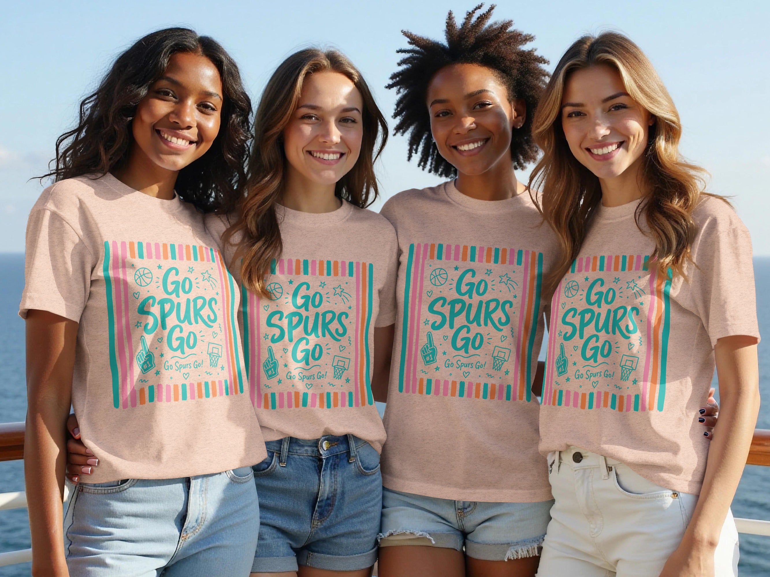 Four women pose wearing matching t-shirts with "Go Spurs Go!" graphic design.