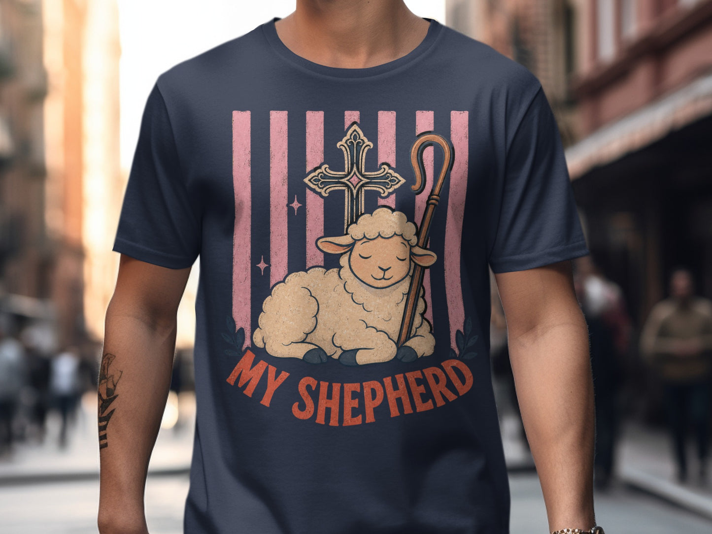 T-shirt with a graphic of a lamb, cross, shepherd's crook, and text "MY SHEPHERD".