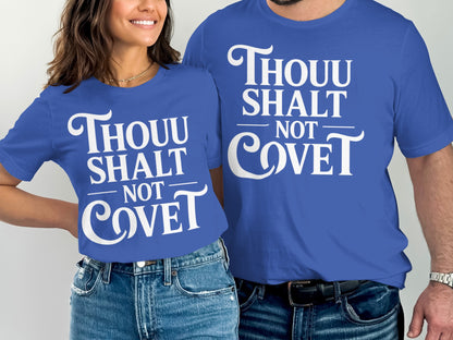 Two people wear blue t-shirts with "Thou Shalt Not Covet" in white text.