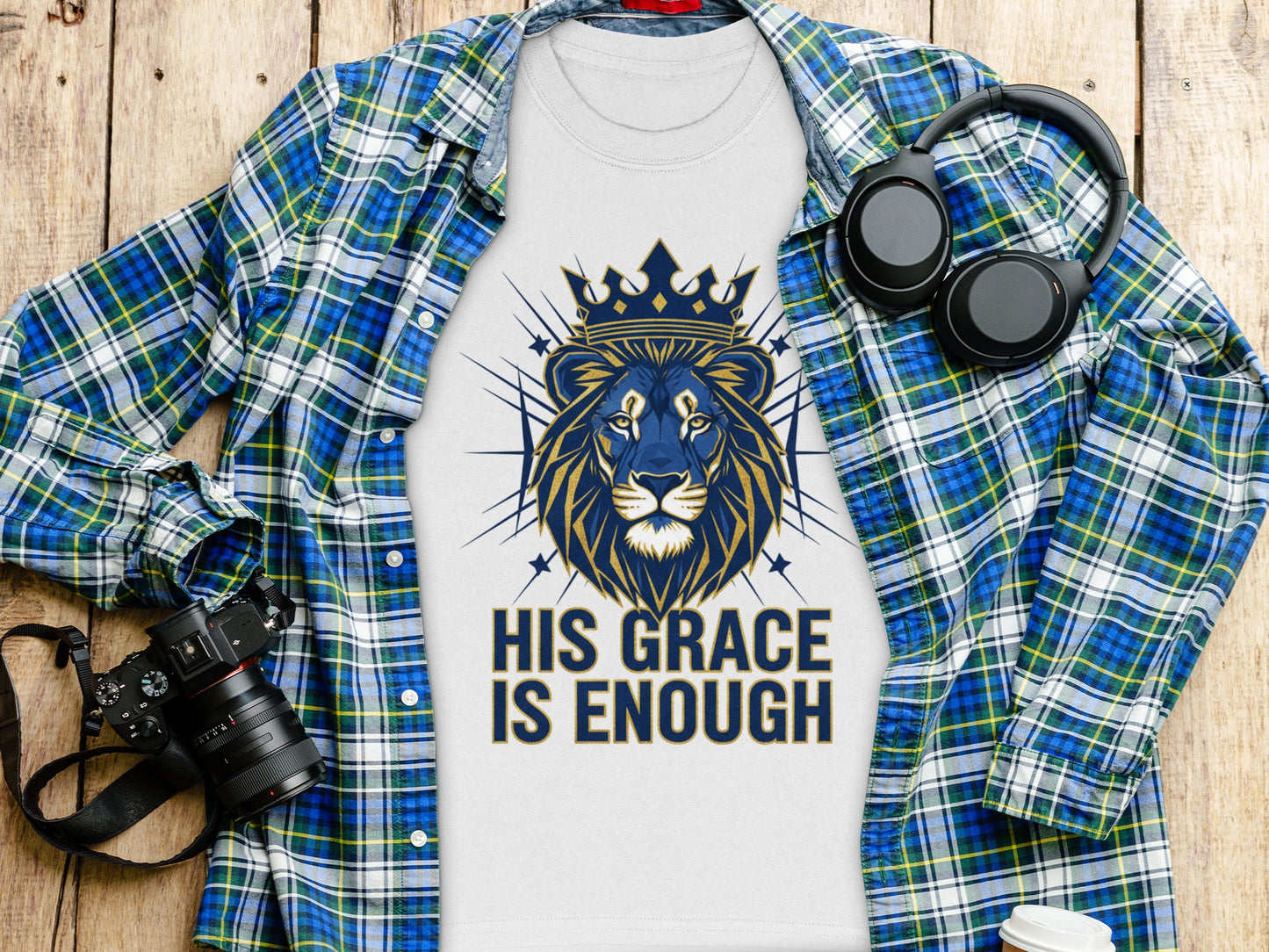 White t-shirt with a blue and gold lion graphic and text "His Grace Is Enough".