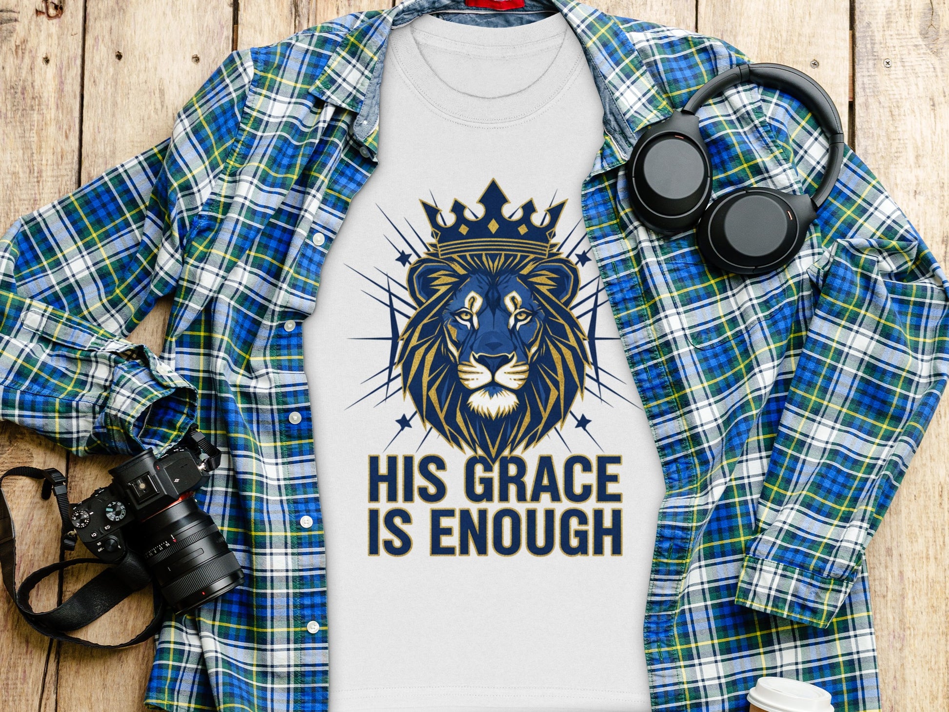 White t-shirt with a blue and gold lion graphic and text "His Grace Is Enough".