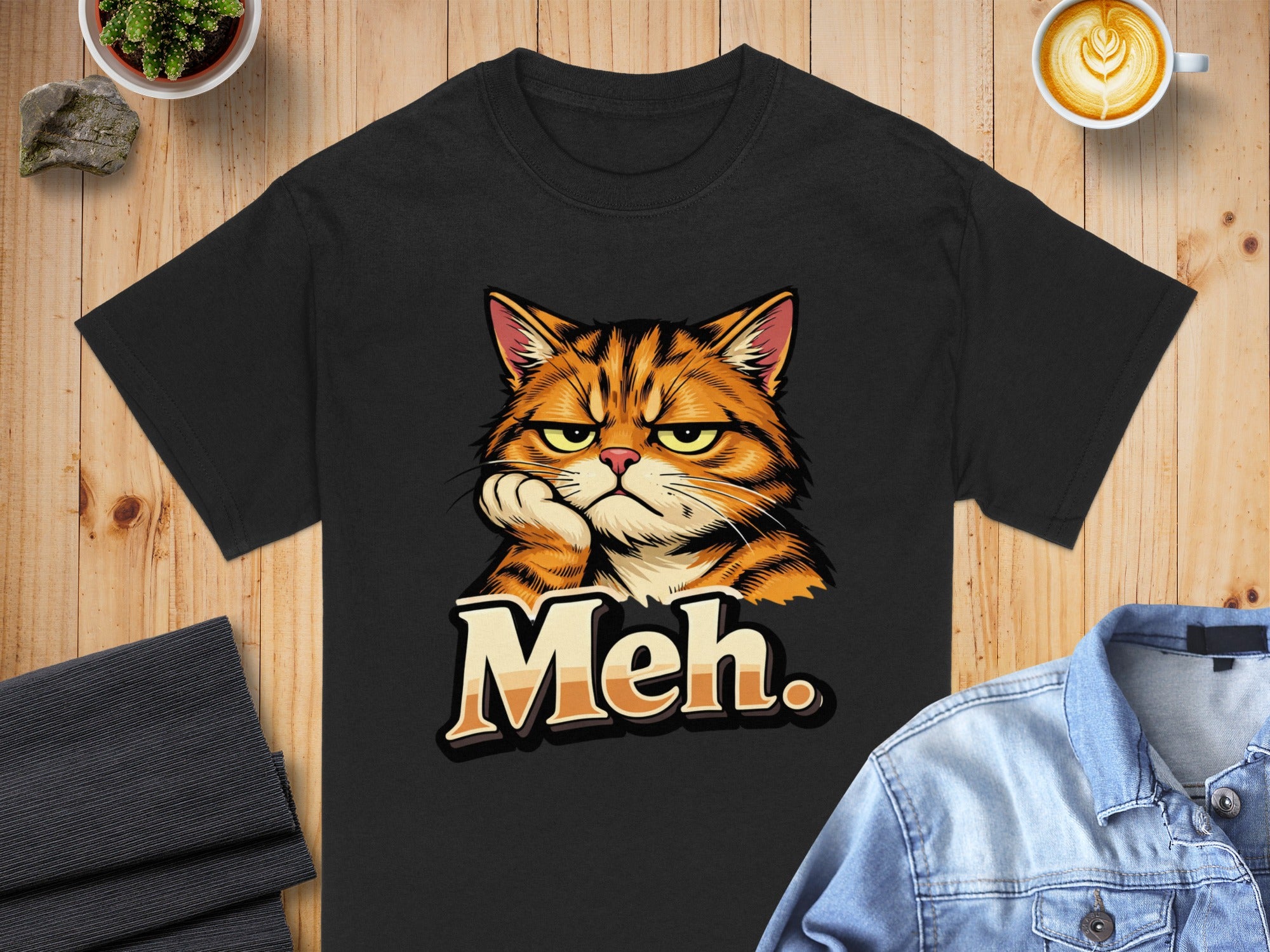 Black t-shirt with cartoon grumpy cat and text "Meh."