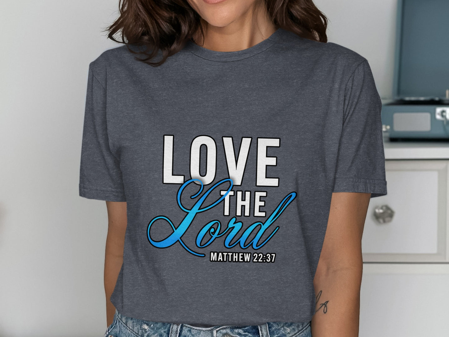 Dark grey t-shirt with "LOVE THE Lord" and "MATTHEW 22:37" text.