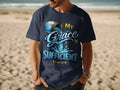 Navy t-shirt with "My Grace Is Sufficient" and "2 Cor 12:9" text.