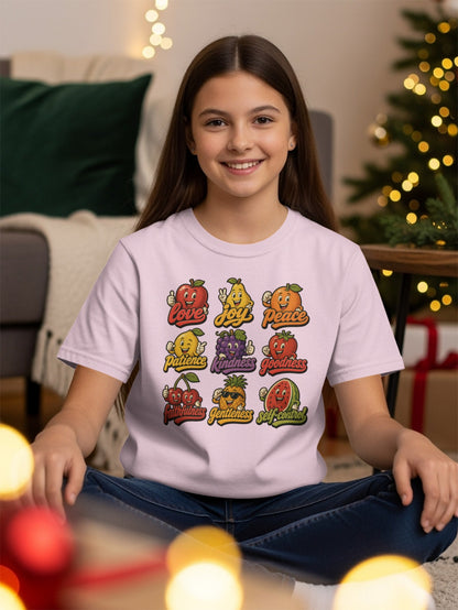 A light pink t-shirt with nine cartoon fruits representing virtues like Love, Joy, Peace, and Goodness.