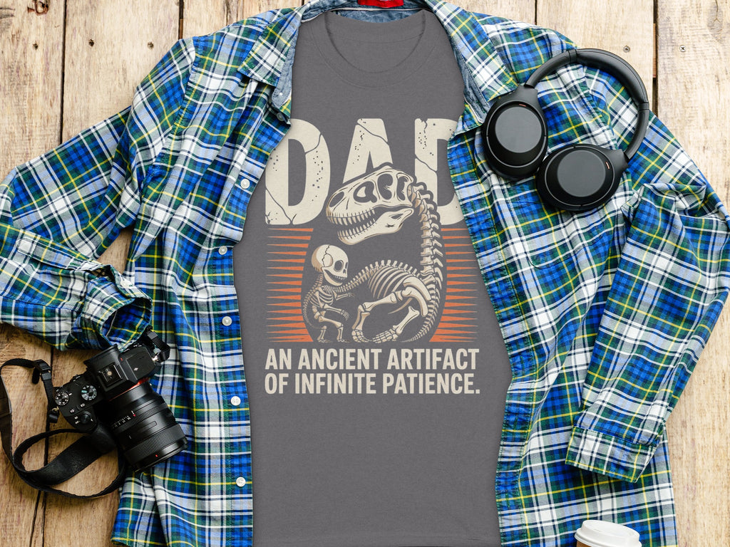 Dad t-shirt with dinosaur skeleton art and "An Ancient Artifact of Infinite Patience" text.