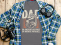 Dad t-shirt with dinosaur skeleton art and "An Ancient Artifact of Infinite Patience" text.