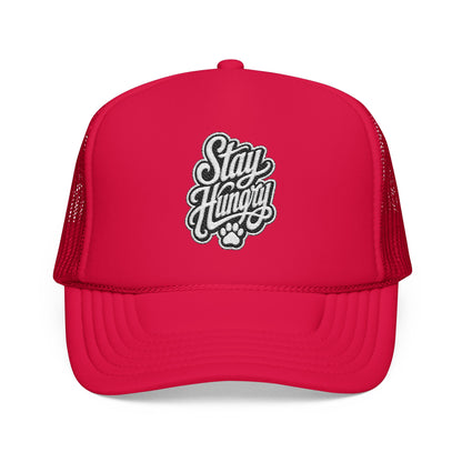 Red trucker hat with embroidered "Stay Hungry" text and a paw print.